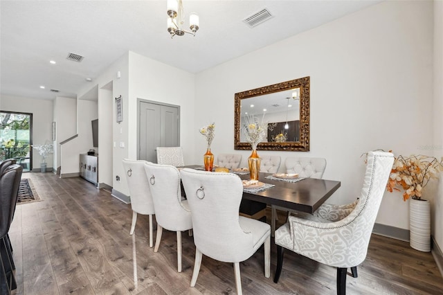 dining area featuring a chandelier and hardwood / wood-style flooring