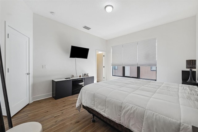 bedroom featuring dark hardwood / wood-style floors