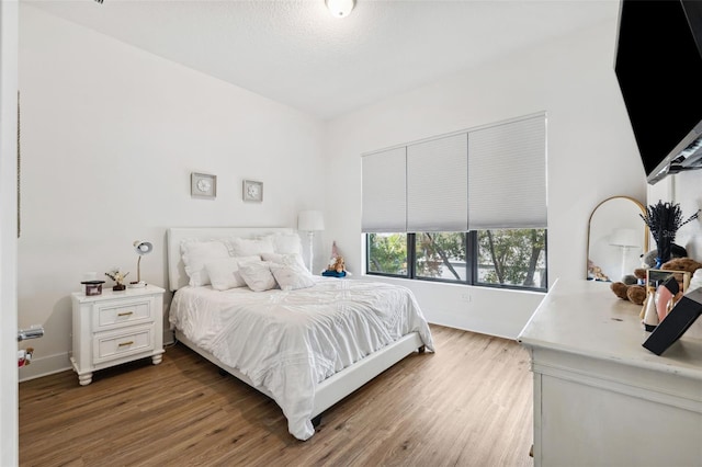 bedroom featuring hardwood / wood-style floors