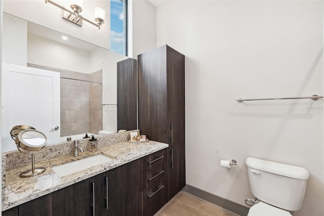 bathroom with tile patterned floors, vanity, and toilet