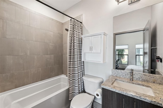 full bathroom with vanity, toilet, and shower / tub combo