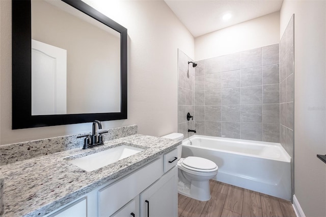 7849 Somersworth Dr, Kissimmee, FL 34747 - full bathroom with vanity, wood finished floors, and shower / bathtub combination