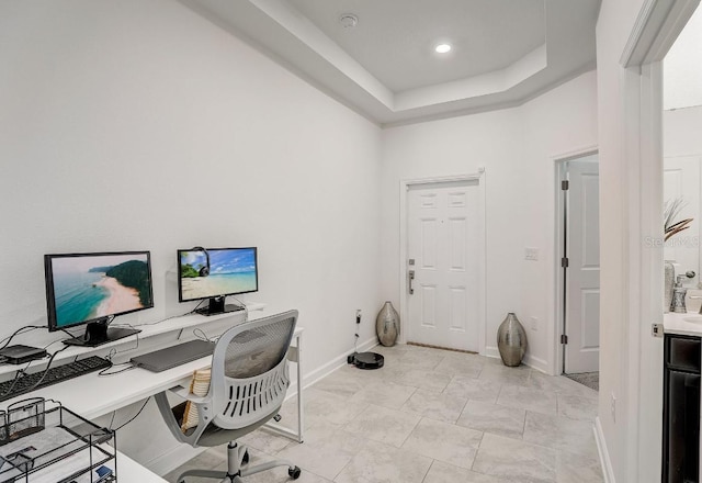 home office featuring a tray ceiling