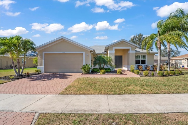 ranch-style house featuring a front yard and a garage