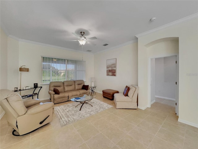 tiled living room with ceiling fan and ornamental molding