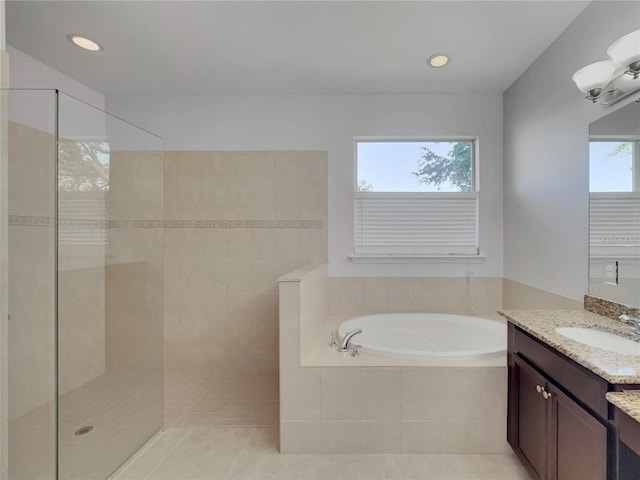 bathroom featuring tile patterned floors, vanity, and independent shower and bath