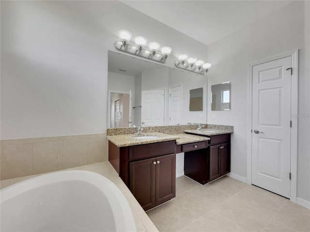 bathroom featuring a bath, vanity, and tile patterned floors