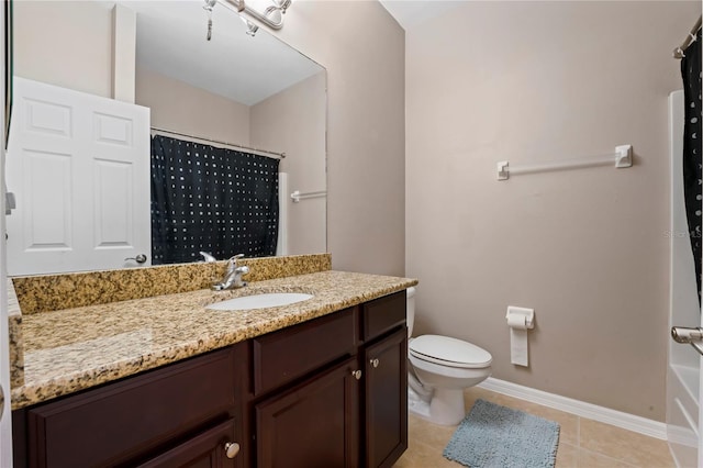 bathroom with toilet, vanity, tile patterned floors, and curtained shower