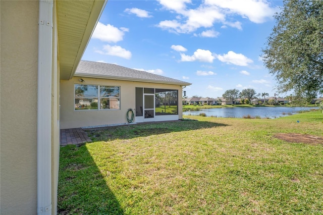 view of yard with a water view