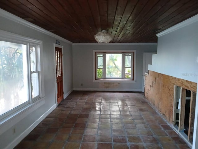 unfurnished dining area featuring a chandelier, dark tile patterned flooring, crown molding, and wood ceiling