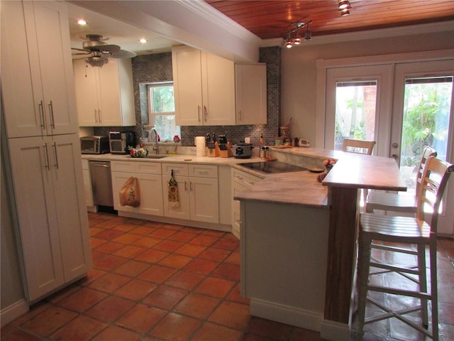 kitchen with dishwasher, white cabinets, decorative backsplash, black electric cooktop, and wood ceiling