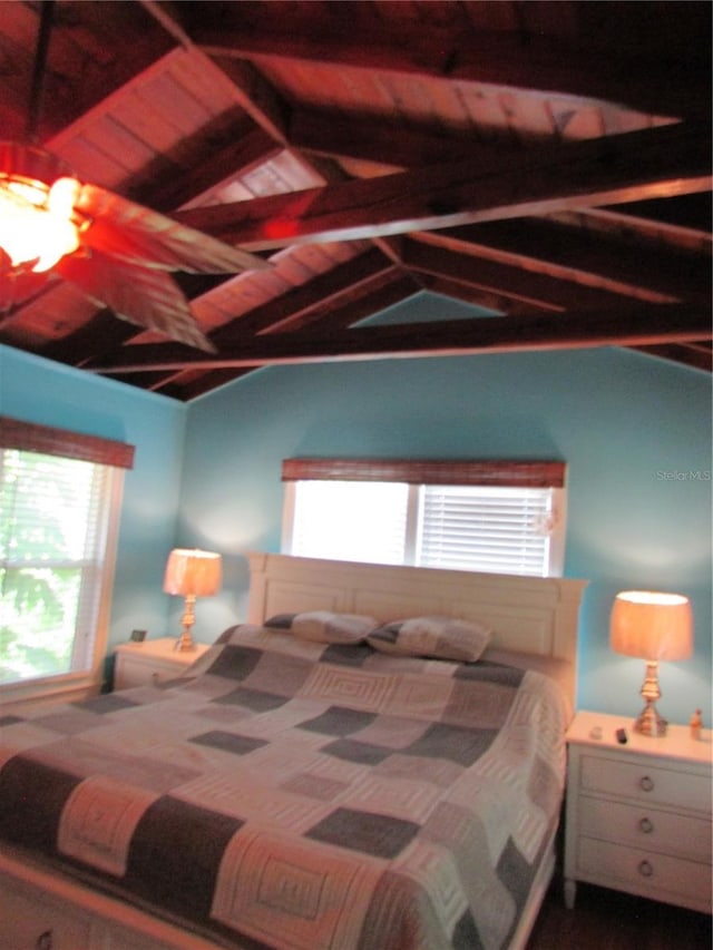 bedroom featuring lofted ceiling with beams and wood ceiling