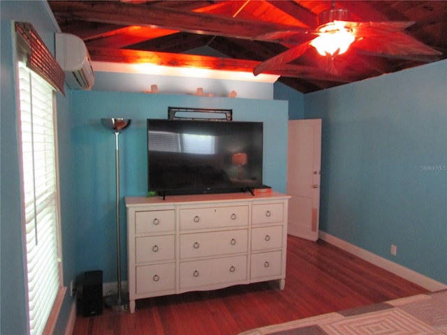 bedroom featuring dark hardwood / wood-style flooring, lofted ceiling with beams, and a wall mounted air conditioner