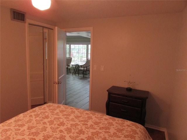 bedroom with a closet and wood-type flooring