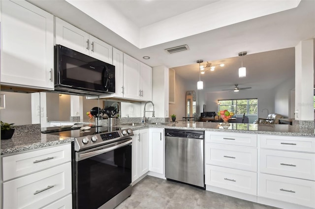 kitchen with appliances with stainless steel finishes, decorative light fixtures, white cabinetry, and ceiling fan