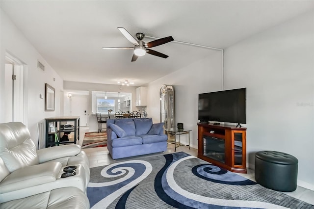 living room featuring ceiling fan