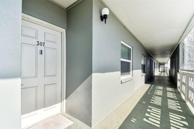 doorway to property with a porch