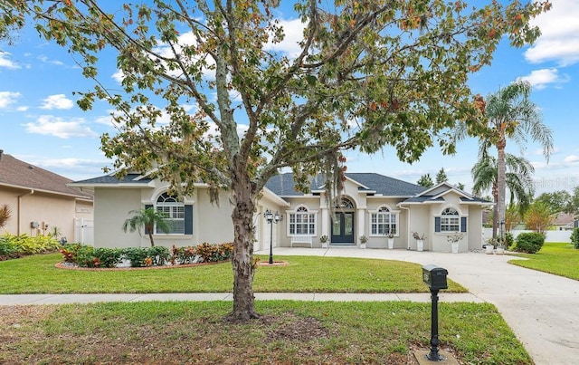 single story home with a front yard