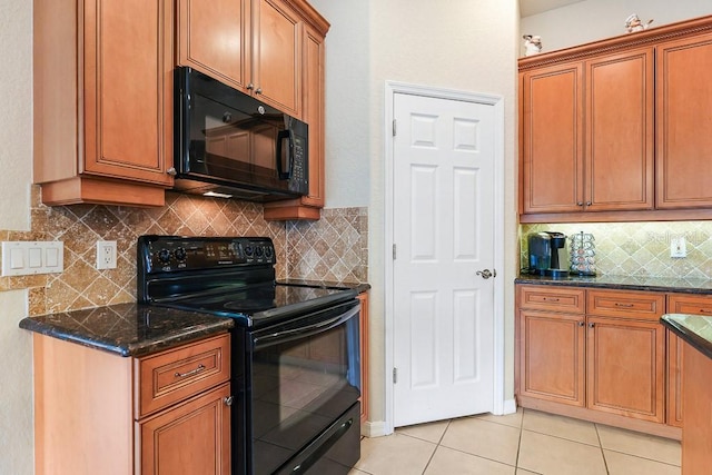 kitchen featuring black appliances, light tile patterned flooring, and backsplash