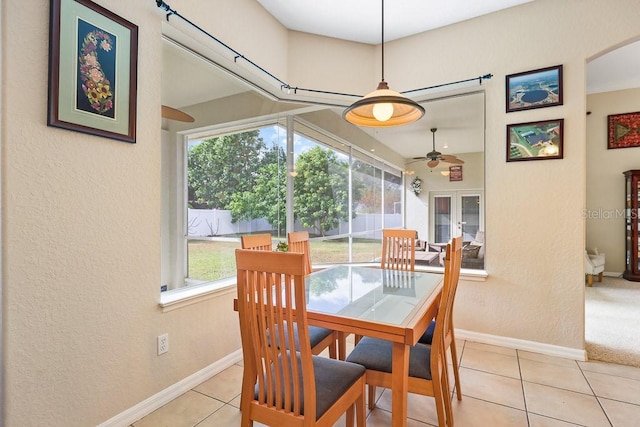 dining area with ceiling fan, a healthy amount of sunlight, and light tile patterned floors