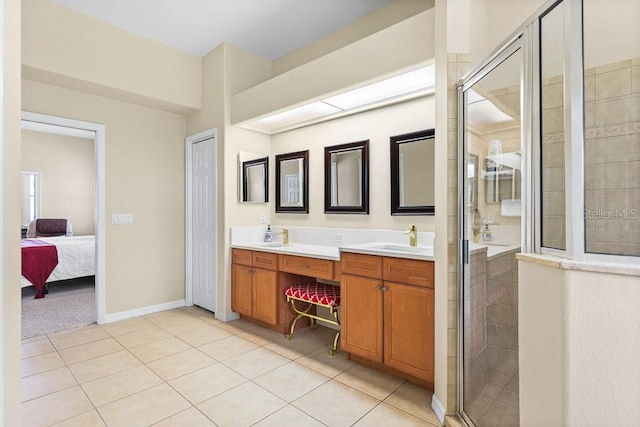 bathroom with tile patterned flooring, vanity, and an enclosed shower