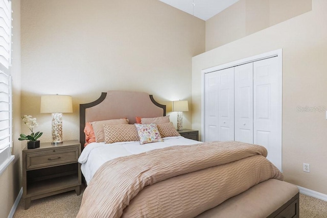 carpeted bedroom featuring a closet