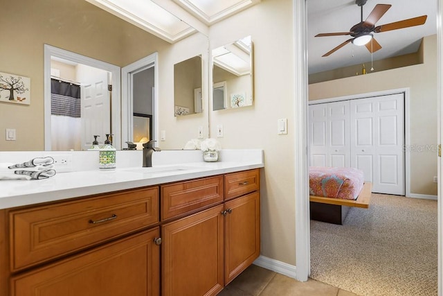 bathroom featuring tile patterned flooring, vanity, and ceiling fan