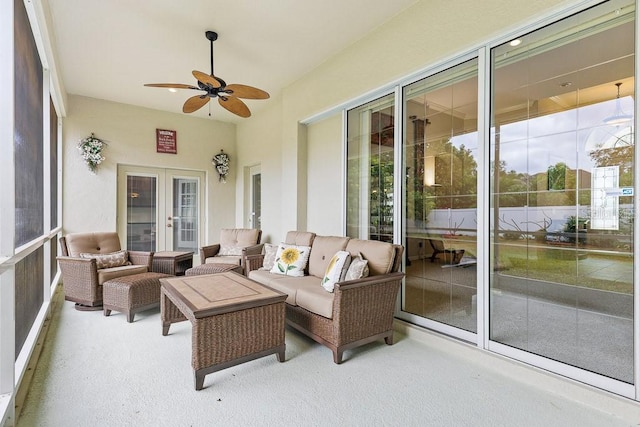 sunroom / solarium with ceiling fan and french doors