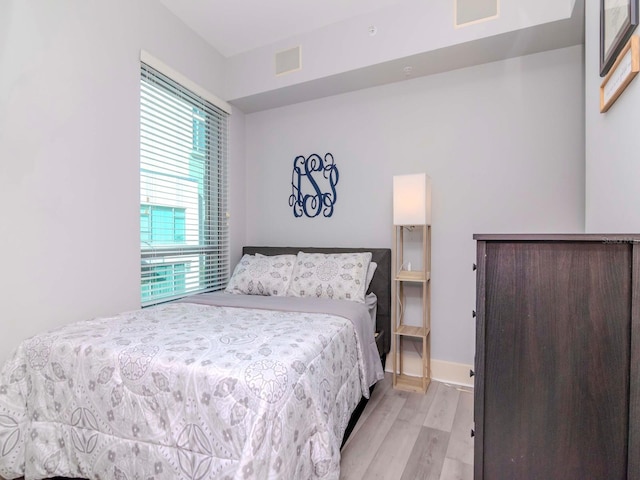 bedroom with light wood-type flooring