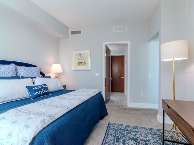 bedroom featuring light carpet