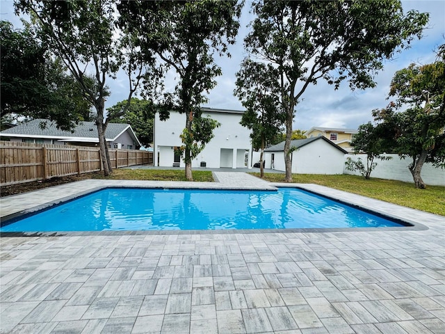 view of swimming pool featuring a patio area