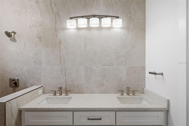 full bathroom with a sink and backsplash