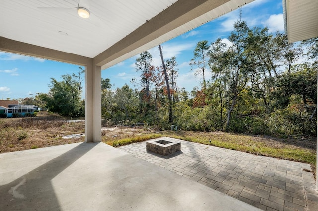 view of patio with an outdoor fire pit