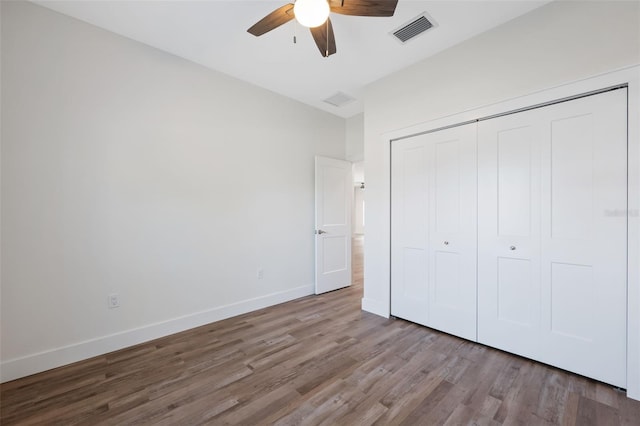 unfurnished bedroom featuring a closet, ceiling fan, and light hardwood / wood-style flooring