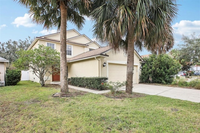 view of front facade featuring a garage and a front lawn