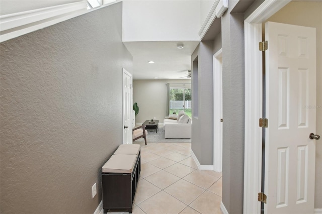 corridor with light tile patterned floors