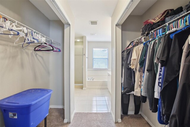 walk in closet featuring light tile patterned floors