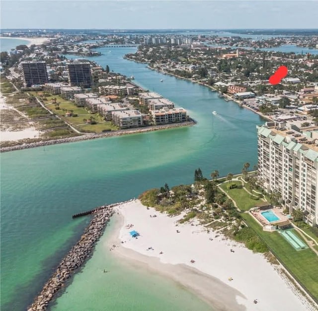 drone / aerial view with a water view and a beach view