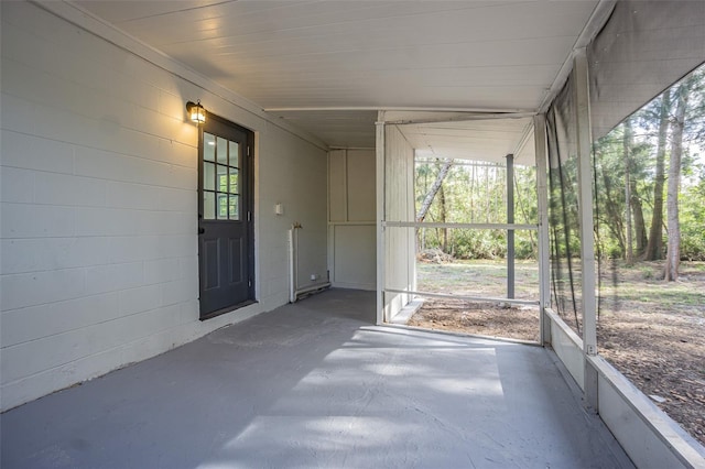 unfurnished sunroom featuring a wealth of natural light