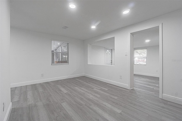 unfurnished room featuring light hardwood / wood-style floors