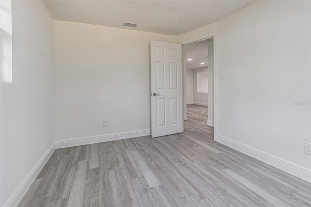 empty room with light wood-type flooring