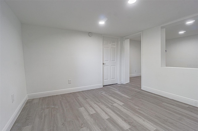 spare room featuring light wood-type flooring