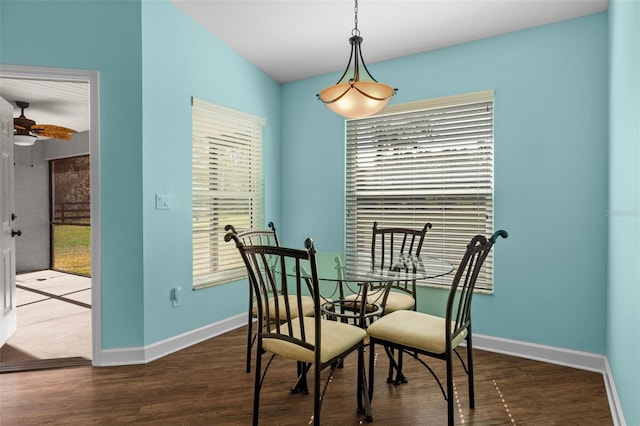 dining area featuring dark hardwood / wood-style flooring and ceiling fan