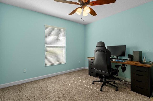 home office with carpet flooring, a ceiling fan, and baseboards