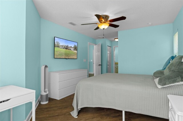 bedroom featuring ceiling fan and dark wood-type flooring