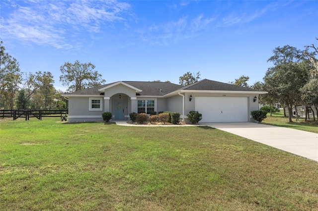 ranch-style home featuring a garage and a front lawn