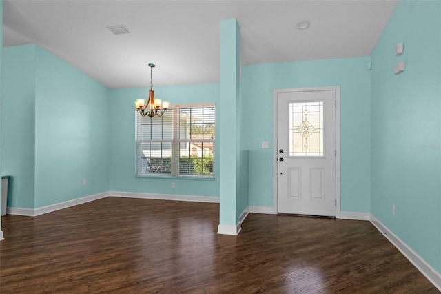 entryway featuring a chandelier, plenty of natural light, baseboards, and dark wood finished floors