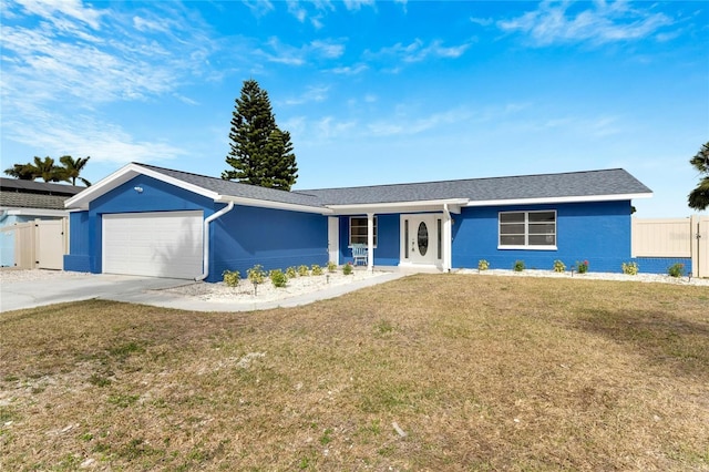 single story home with a front yard and a garage