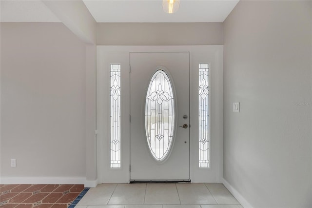 foyer featuring light tile patterned flooring