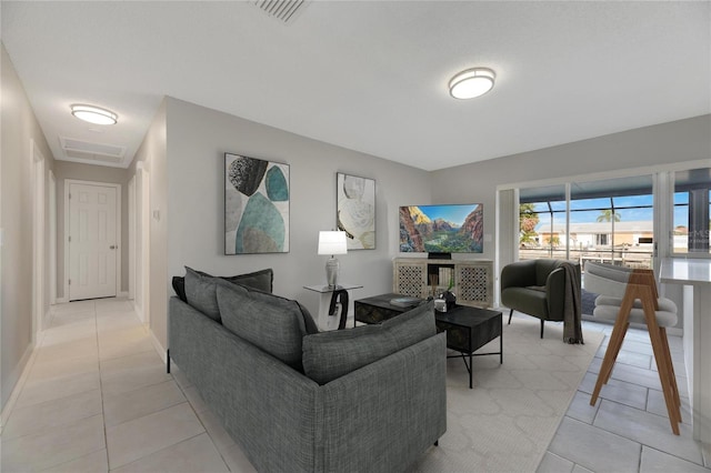 living room featuring light tile patterned flooring